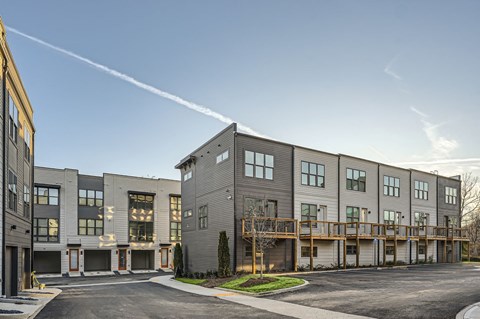 A modern apartment complex with a clear sky above.