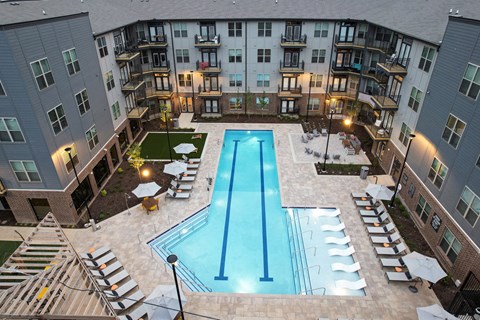 an aerial view of an apartment complex swimming pool