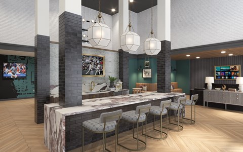 A modern kitchen with a long island and bar stools.