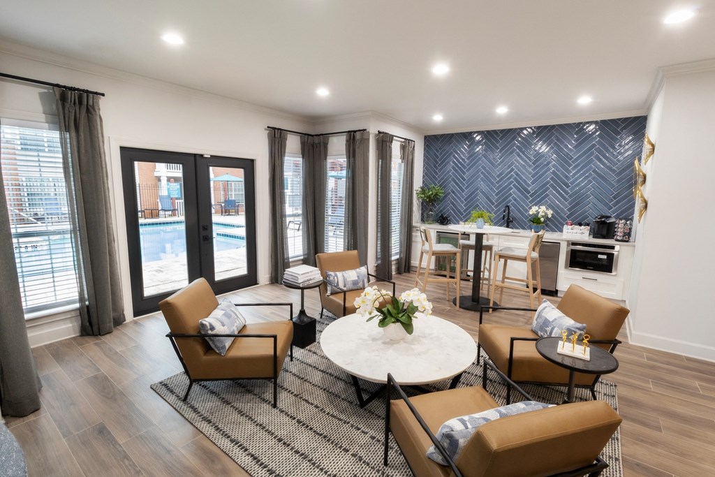 a living room with a table and chairs and a pool