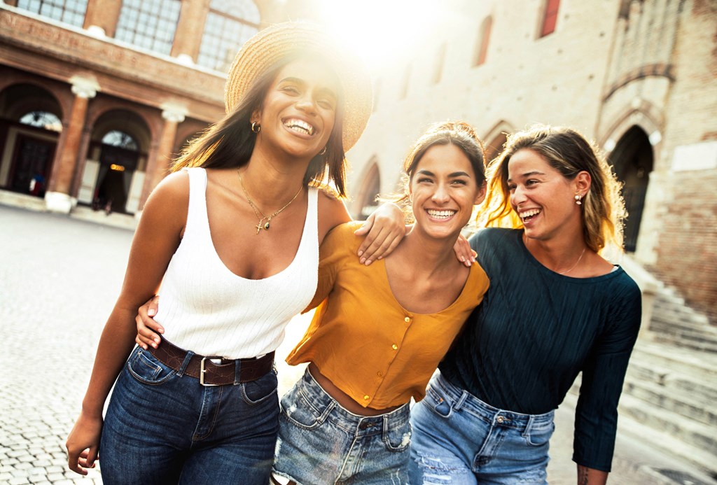 a group of women walking down a street