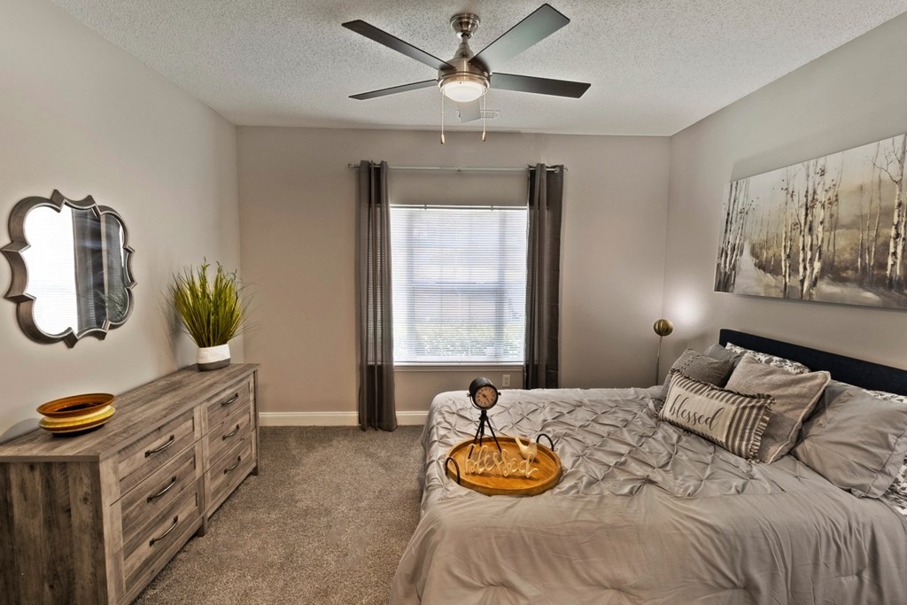 secondary bedroom in model with queen bed at Lullwater at Calumet, Newnan