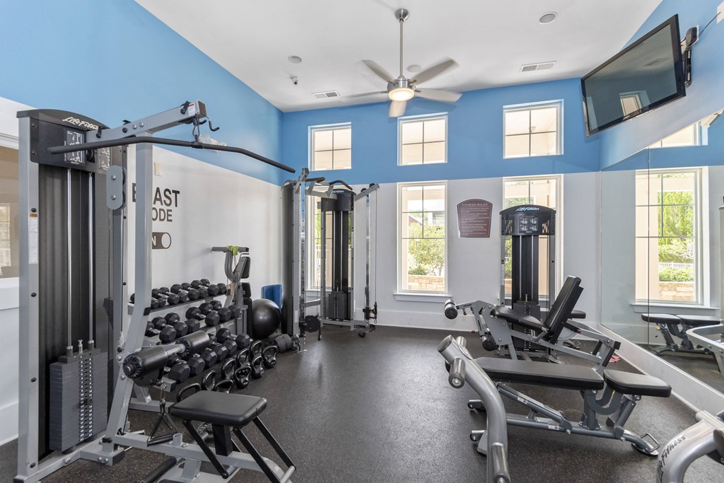 the gym with weights and equipment at 1861 muleshoe road