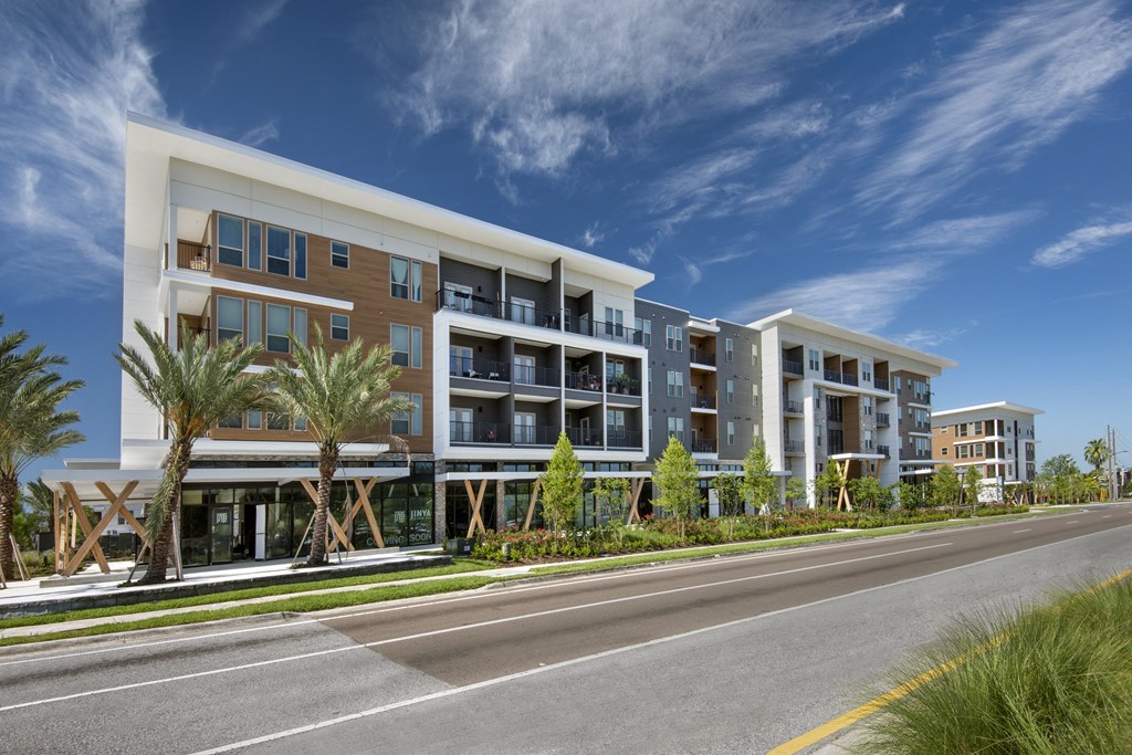 a rendering of an apartment building on a sunny day