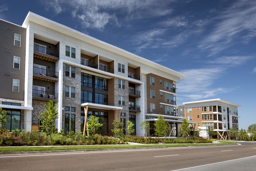 a rendering of a large apartment building on a sunny day - Photo Gallery