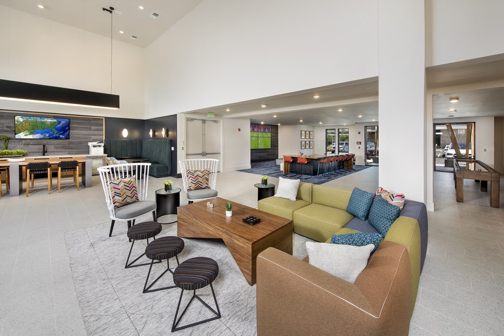 a living room filled with furniture and a flat screen tv