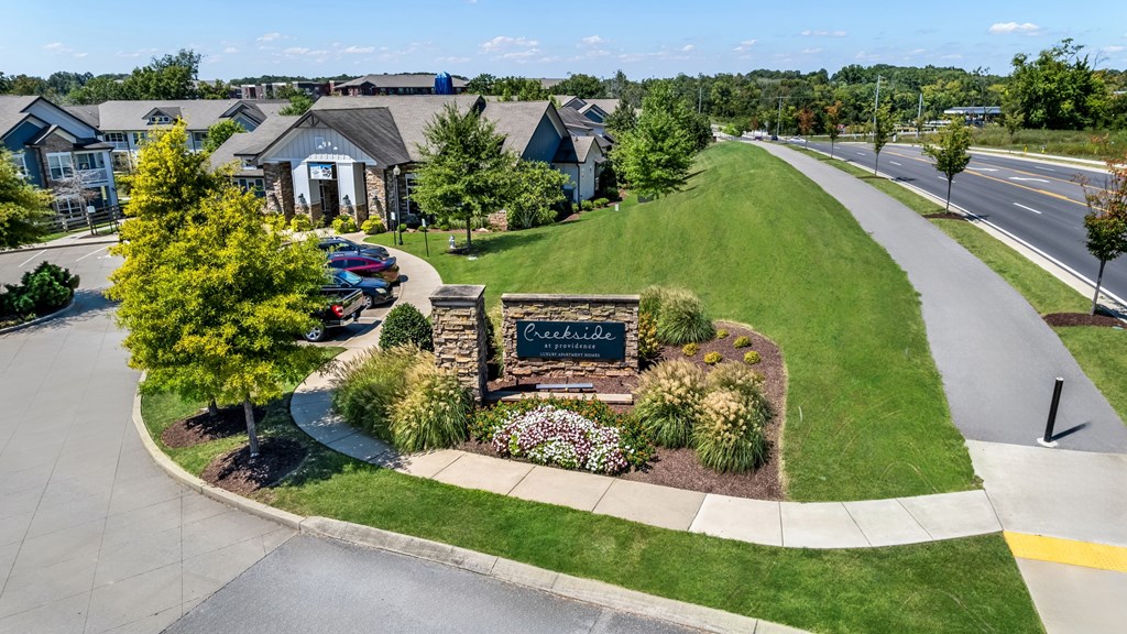 A sign in front of a building that says "Crossroads".