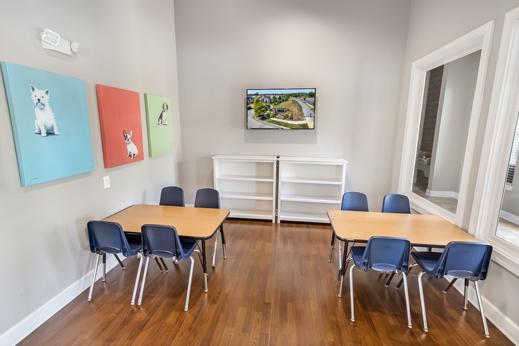 A conference room with a long table and chairs.