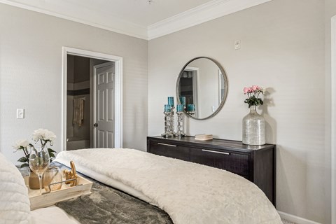 A bedroom with a large bed and a mirror above it at Echo at Lake Norman, Mooresville