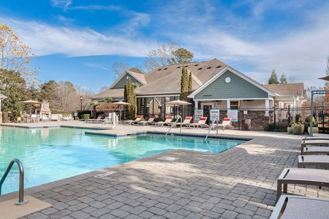 A large swimming pool with a house in the background at Echo at Lake Norman, Mooresville