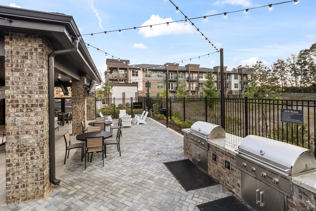 the preserve at ballantyne commons commons outdoor patio with grill and tables and chairs