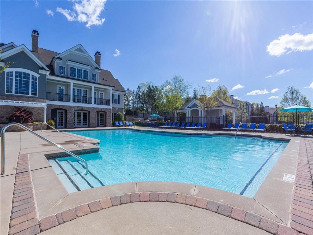 pool with sundeck and patio seating at The Pointe at Suwanee Station, Suwanee, GA