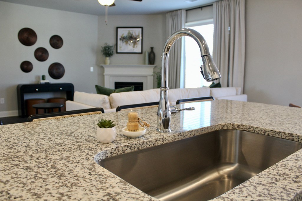 a kitchen with granite counter tops and a sink