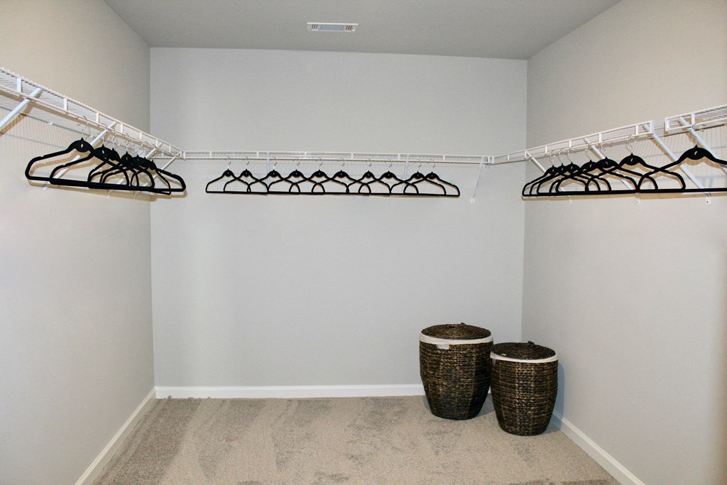 the walk in closet at the enclave at woodbridge apartments in sugar land tx