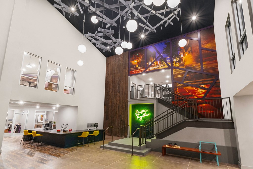 the lobby of a building with a lobby area and a staircase