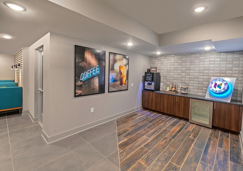 a lobby with a coffee bar and a vending machine