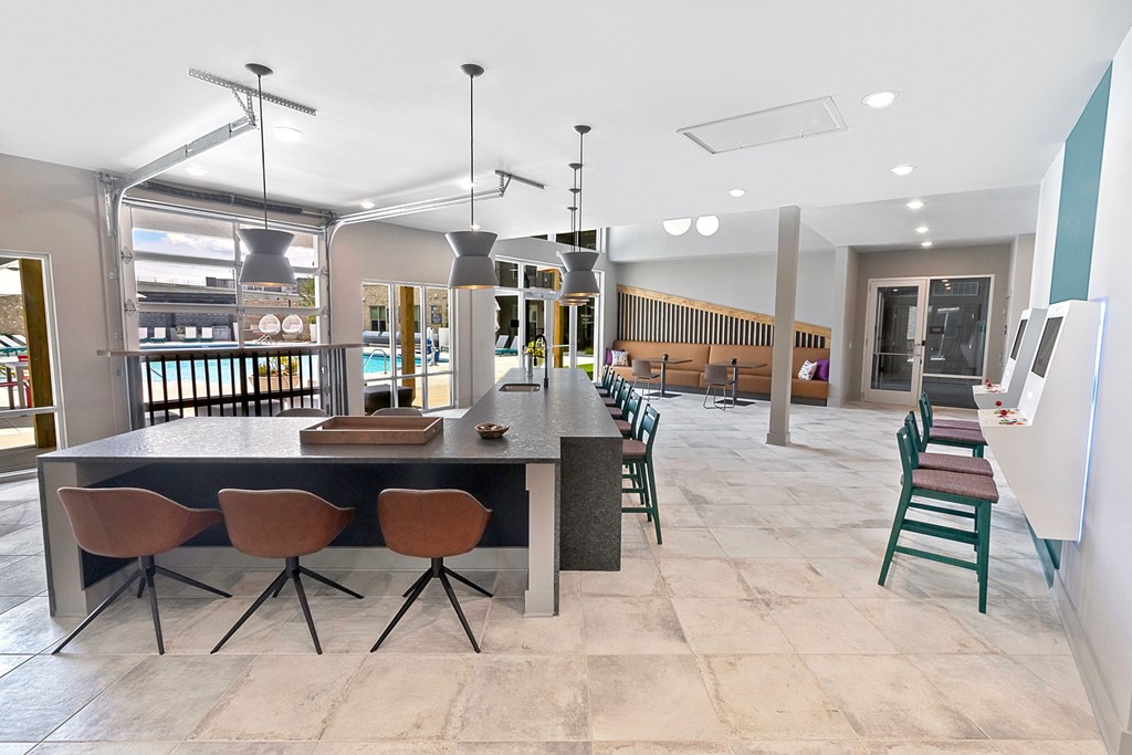 a large dining room with a long table and chairs