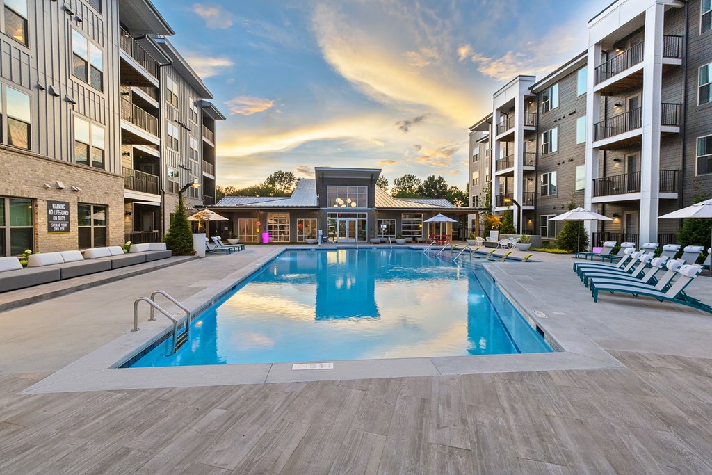 a swimming pool in the middle of an apartment building