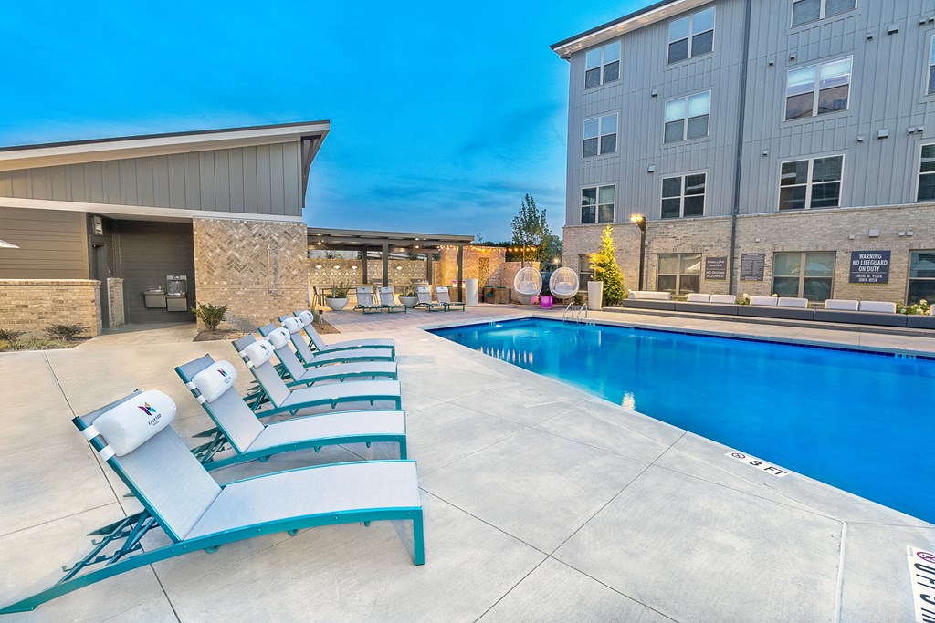 our apartments have a large pool and lounge chairs