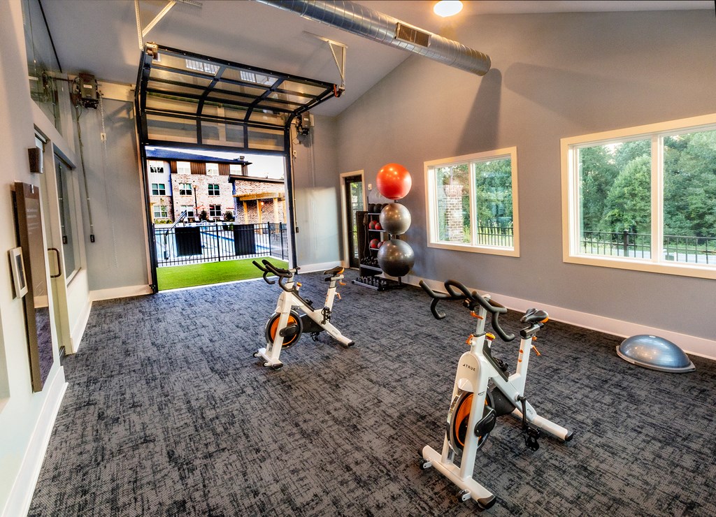 workout room at the district at highland village apartments in lowenthal tx