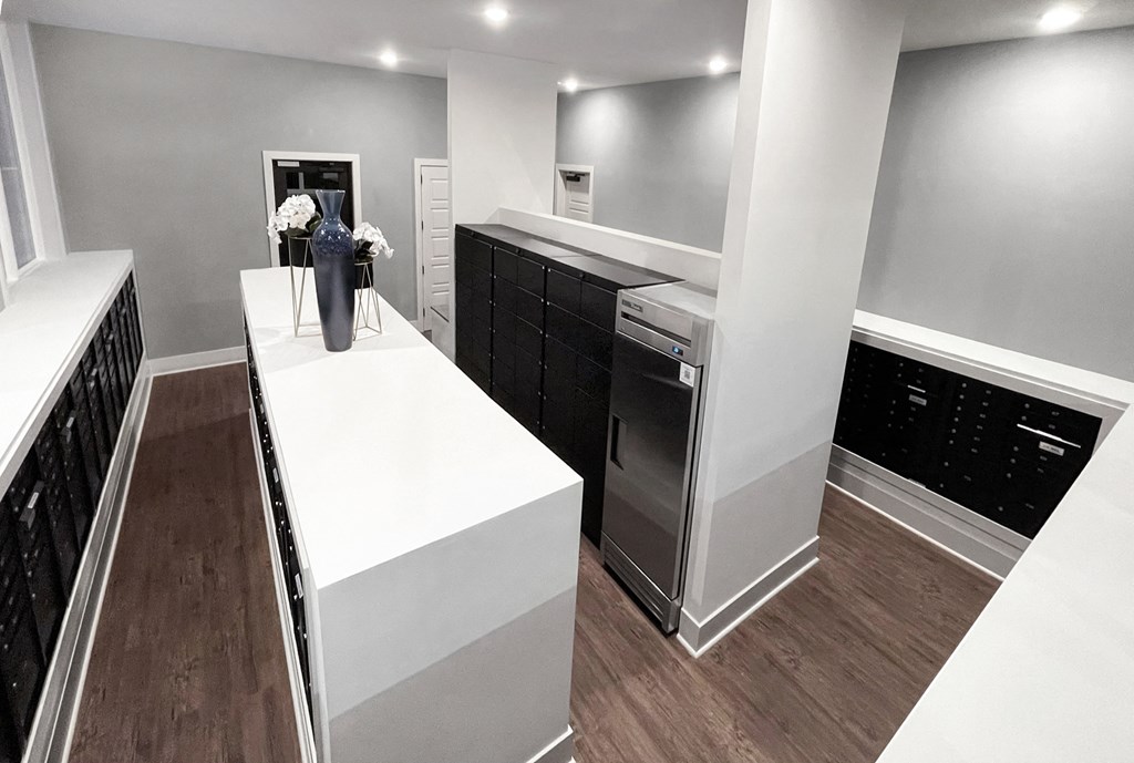 a new kitchen with a white island and stainless steel appliances