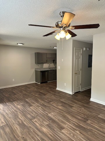 A room with a ceiling fan and wooden flooring.