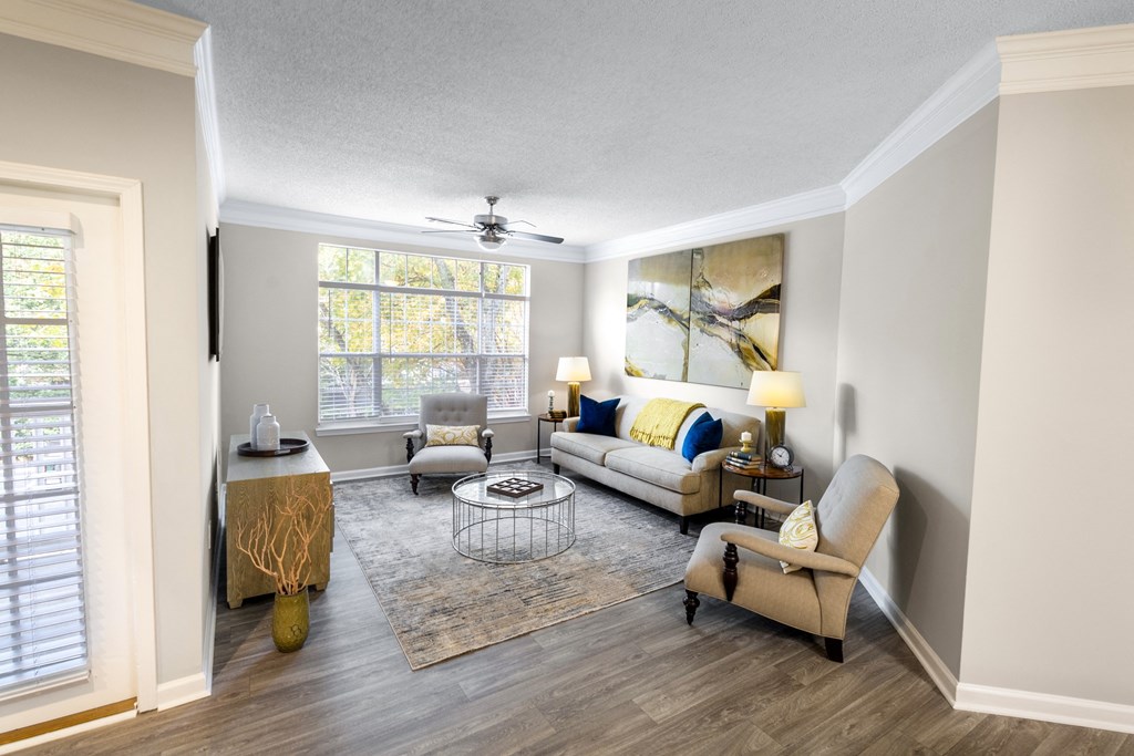 a living room with a couch and chairs and a ceiling fan at Parc at Perimeter, Georgia, 30328