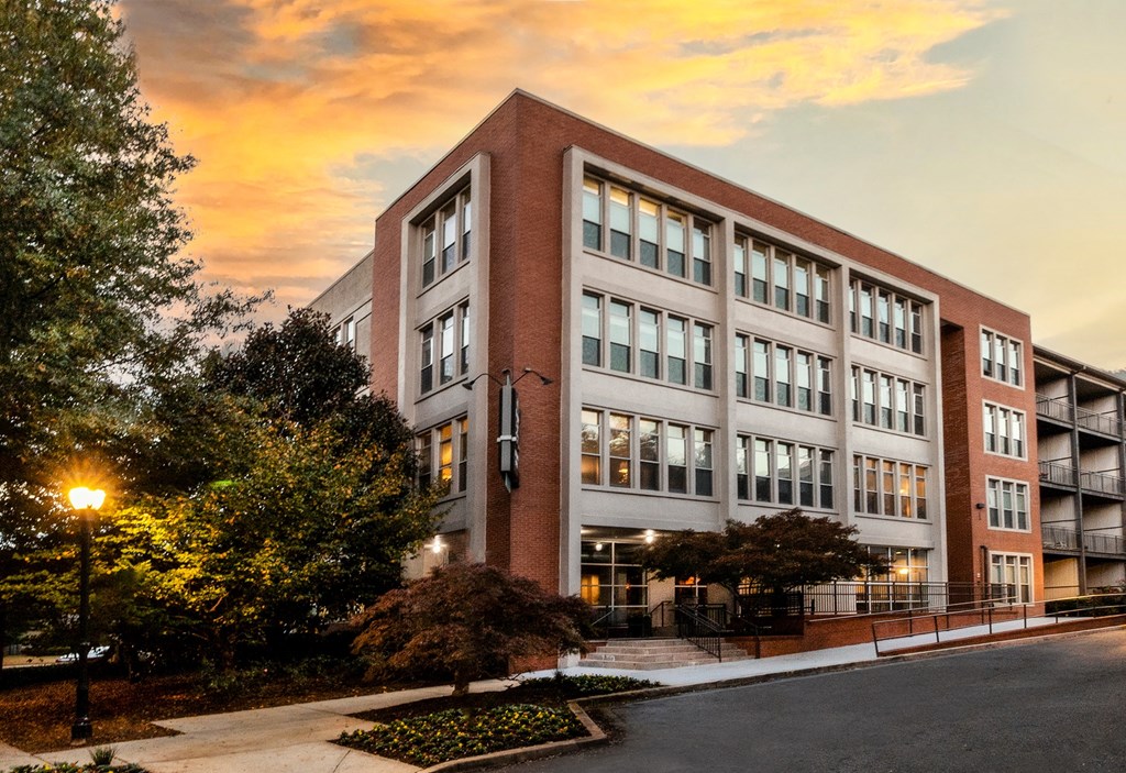 Building view leasing office with a sunset behind it at Mariposa Lofts, Atlanta, GA