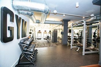 Gym with weights at Mariposa Lofts, Atlanta, Georgia