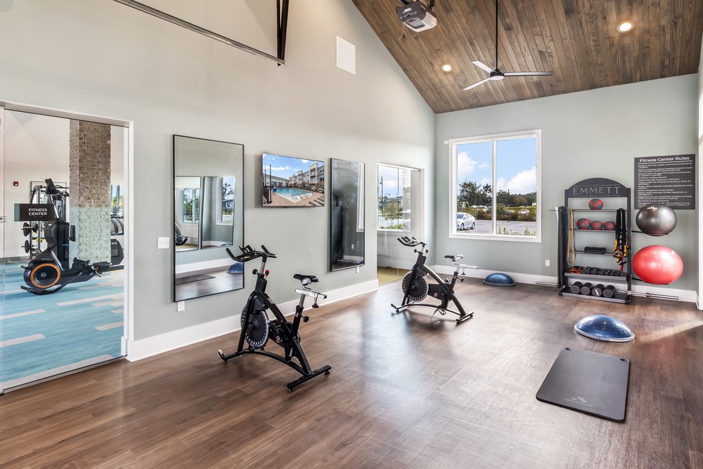 the gym at the district at highland village apartments