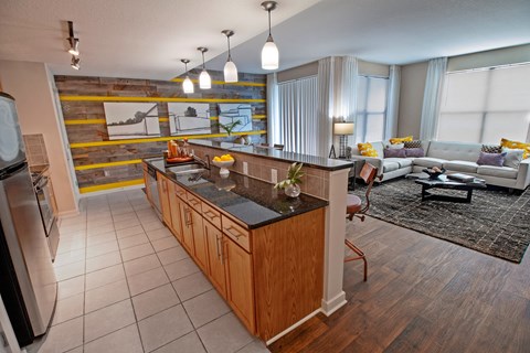a kitchen with a counter top in a living room