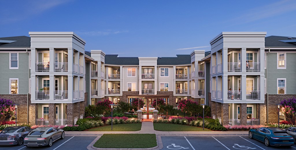 a rendering of an apartment complex with cars parked in a parking lot