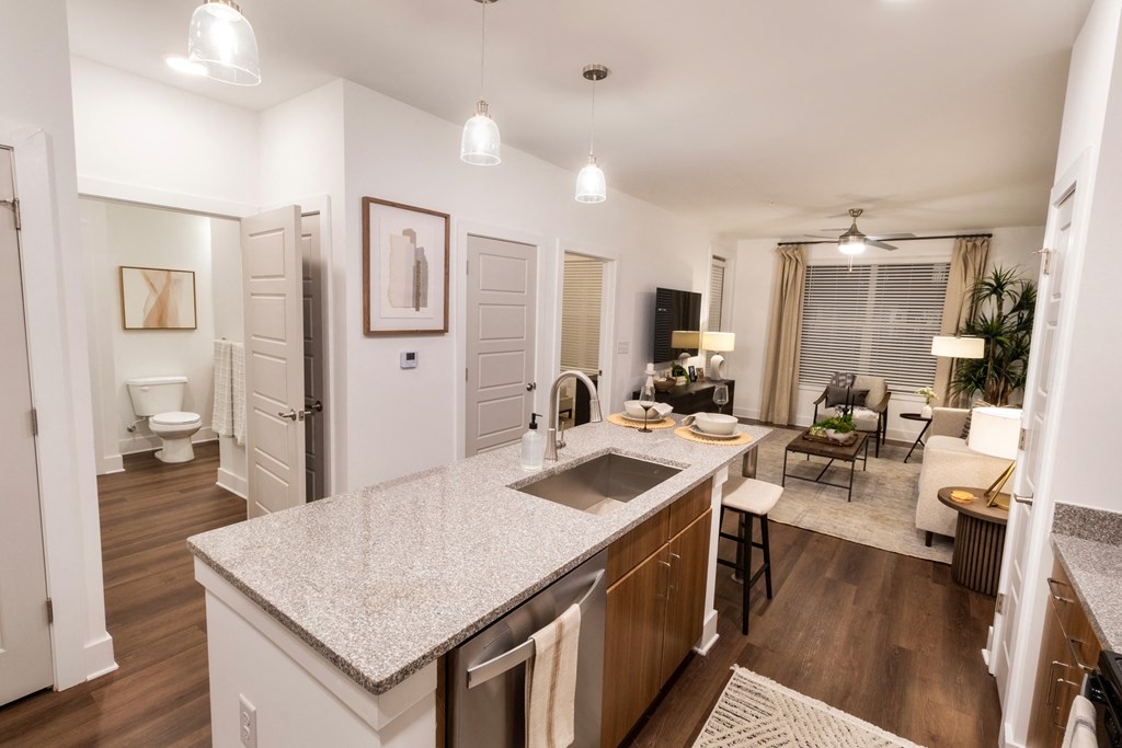 an open floor plan with a kitchen and a living room