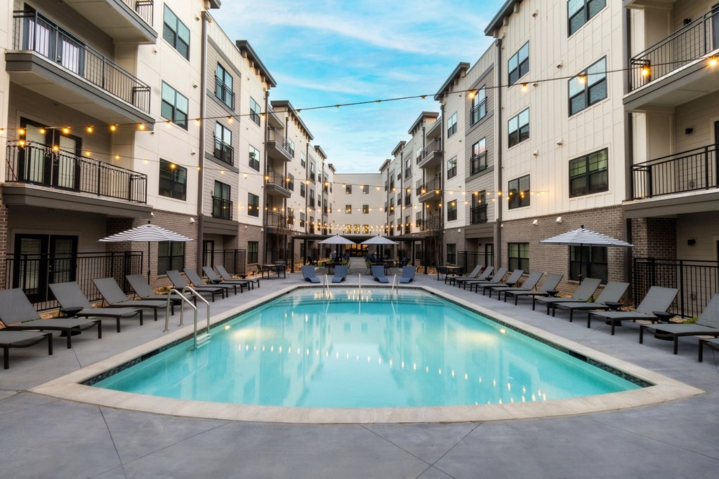 a swimming pool in the middle of an apartment building