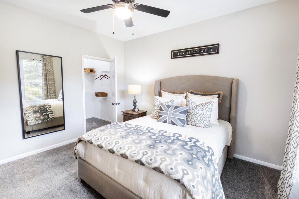 a bedroom with a bed and a ceiling fan at The Pointe at Suwanee Station, Suwanee, 30024