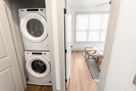 a small laundry room with a washing machine and a dryer