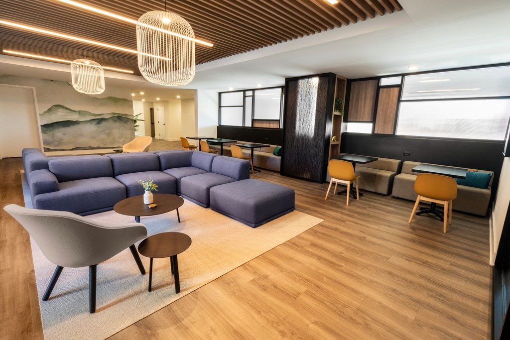 a rendering of a living room with a couch and tables