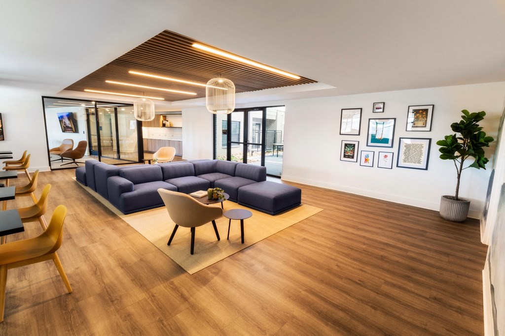 a living room with a couch and a table and chairs