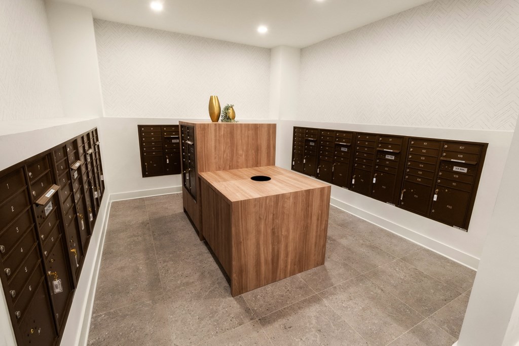 a large wooden desk in a room with a bunch of filing cabinets