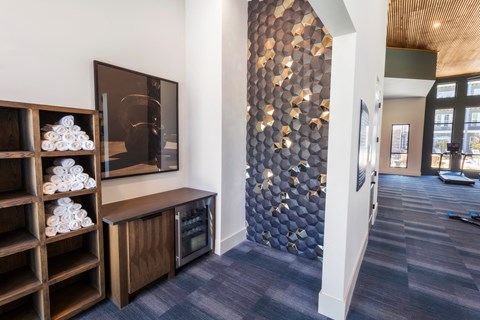 a hallway with a blue and white hallway wall with a checkered accent wall