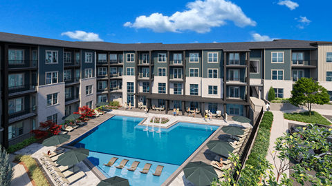 A large swimming pool surrounded by lounge chairs and umbrellas in front of a multi-story apartment building.
