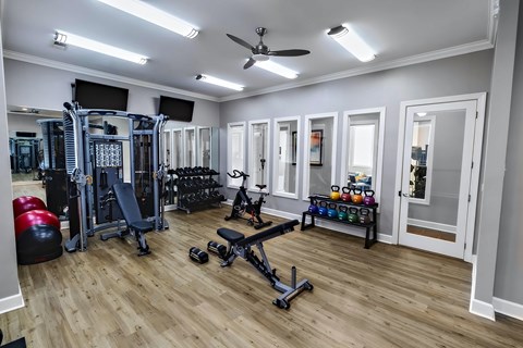 A well-equipped home gym with a variety of exercise equipment.