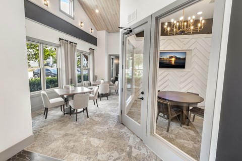 A dining room with a table and chairs is shown.