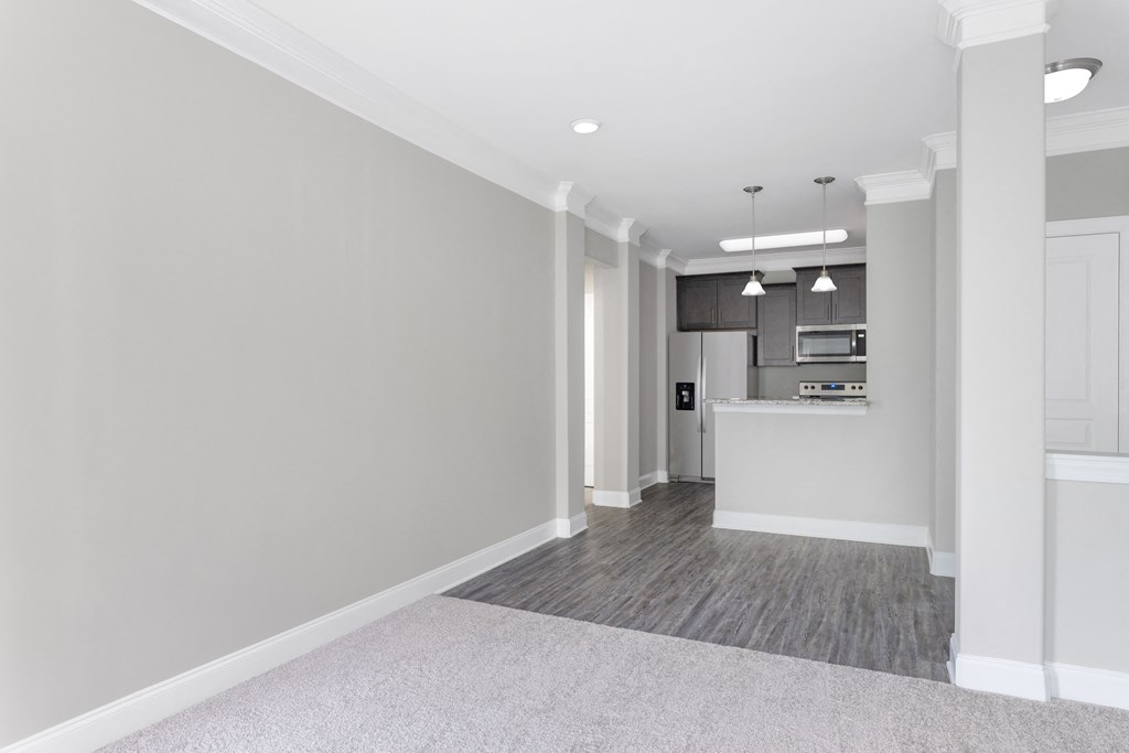 a kitchen and dining area in a 555 waverly unit