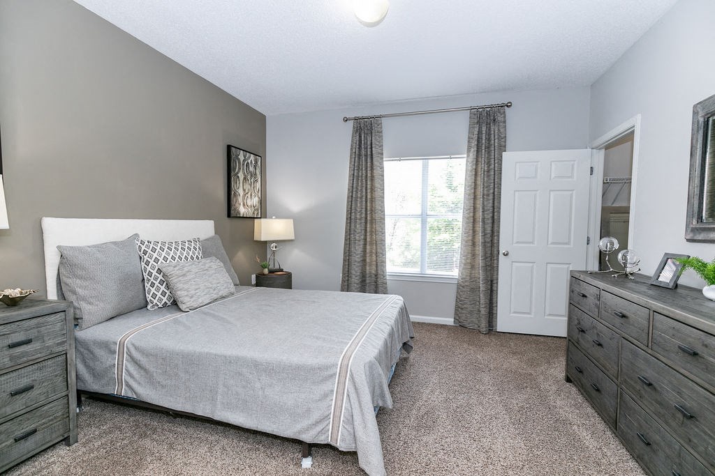 Bedroom With Expansive Windows at Villas at Hampton, Hampton