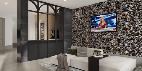 A modern living room with a television on the wall.