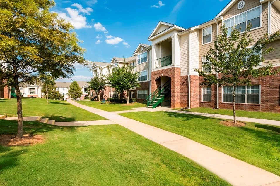 A sunny day at a residential area with houses and green lawns. at The Dawson Cartersville in Cartersville, GA 30191