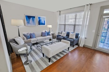 a living room with hardwood floors and a sliding glass door - Photo Gallery 18
