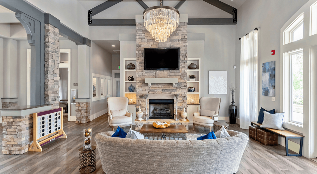 a living room with a large couch and a fireplace