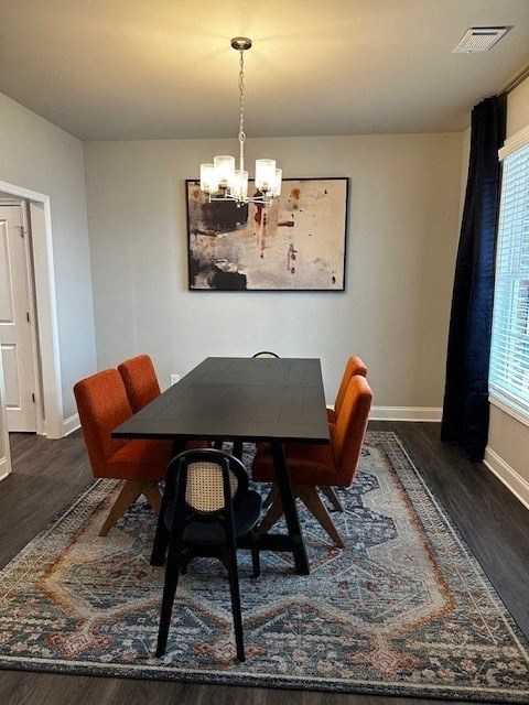 a dining room with a table and chairs